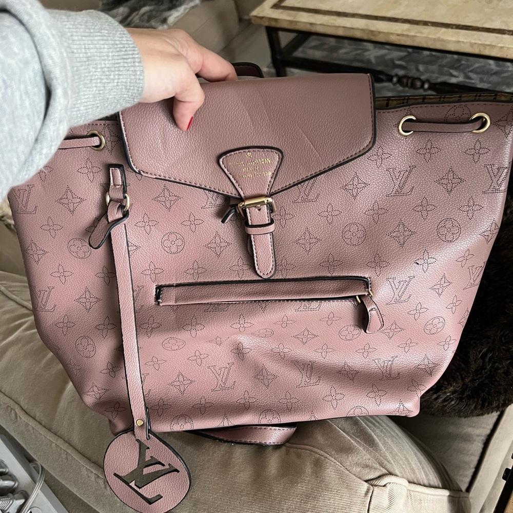 Pink real leather backpack. Never used.